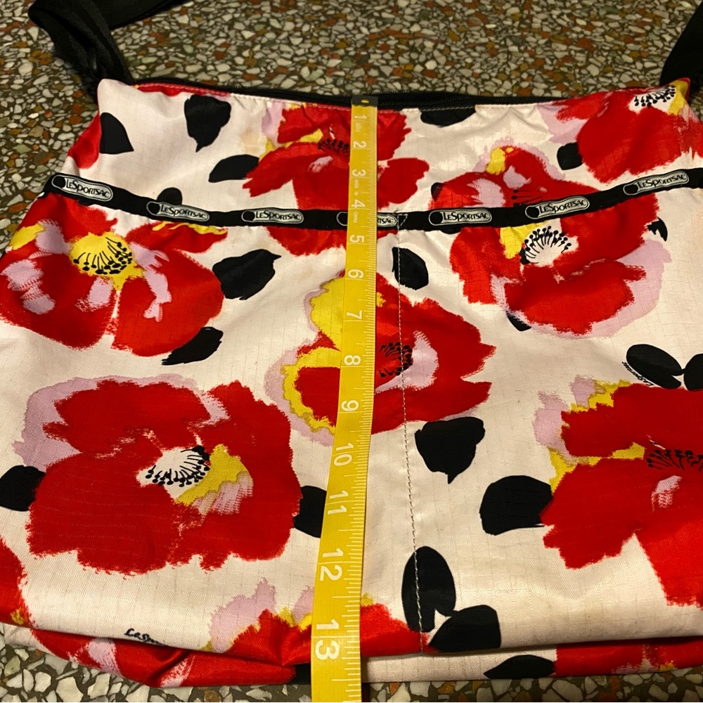 Great bag for travel or weekends. Nylon LeSportSac with zip top